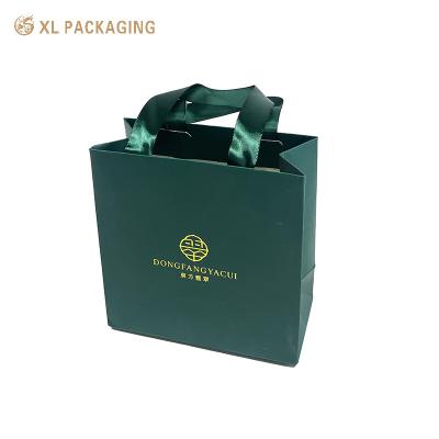 China Luxus-Boutique Schmuck Geschenktasche Custom Druckband Papier Souvenir-Einkaufstüte zu verkaufen