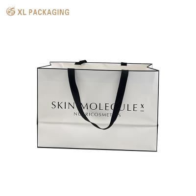 China Custom Printed Personalized Paper Bag For Shopping Handle Bag Shoes Clothing Packing Logo Printing Shopping Bag for sale