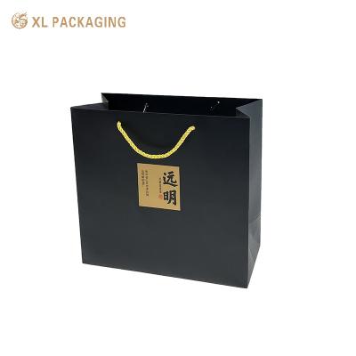 China Design Recycle Paper Bag Kraft Paper High Quality Cosmetic Clothing Paper Box With Logo for sale