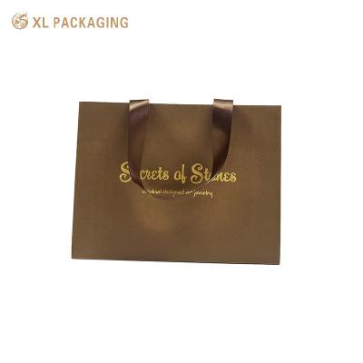 China Paper Bag Handmade Custom Logo Packaging Cosmetic Products Shopping Bag with Handle for sale