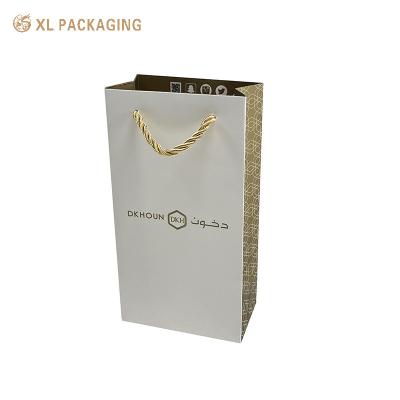 China Gold Color Recyclable Packaging Bags Fancy Opp String Handle Shopping Paper Bag for sale