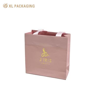 China Custom Color Pink Present Paper Packaging Bags Gift Shipping Bag Logo Printed for sale