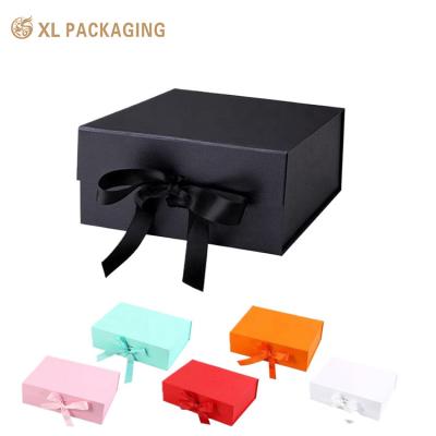 China Eco Friendly Custom Logo Luxury Foldable Magnetic Closure Book Folding Flat Pack Gift Boxes Embossed With Ribbon for sale