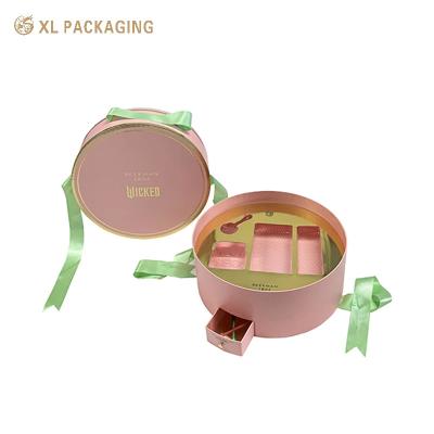 China Round Cosmetic Paper Box With Unique Design Mini Drawer Box Green Ribbon Handle And Gold Tray For Beauty Essentials for sale