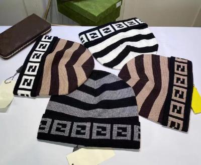 China JOINT Famous Brand Designer Solid Color Winter Hat Hot Sale Fashion Knitted Luxury Hats For Men And Women for sale