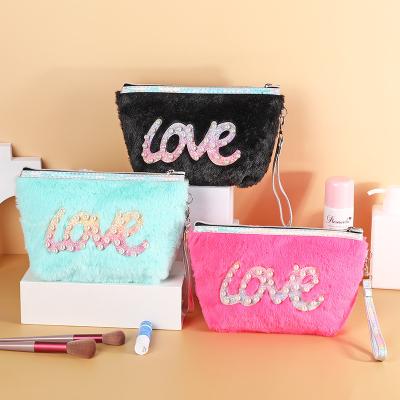 China Letter Elegant Love Fashion Pearl Cosmetic Bags Shape Soft Winter Fur Zipper Pouch Storage Travel Makeup Bags Colorful for sale