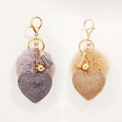 China Wholesale Cute Women's Bag Ornament Rabbit Pompom Puff Ball Faux Stone Leather Heart Shape Leather Key Chain With Tassels for sale