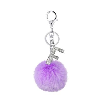 China More color for choose english pom pom faux fur ball bag accessories diamond 26 letters key chain for sale