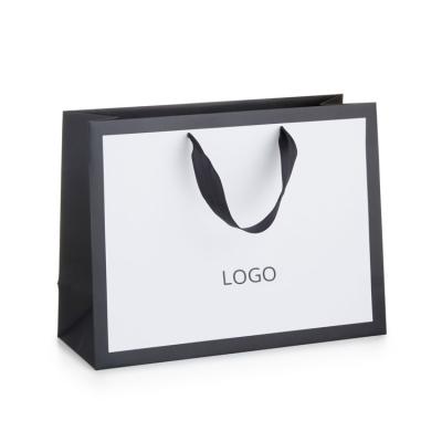 China Hot Selling Recyclable Personalized Custom Luxury Paper Packaging Shopping Bag For Clothes Shoes Jeans for sale