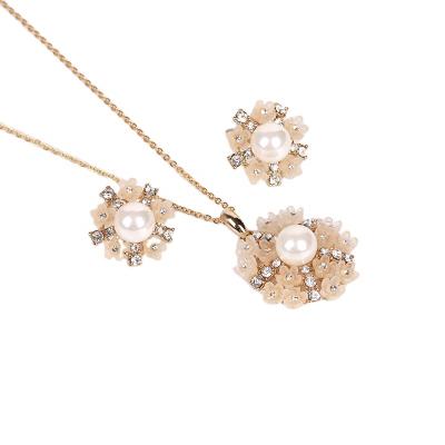 China TRENDY FACEINS pearl flower earrings necklace set women flower ball rhinestone jewelry set bridal gold plated jewelry set for sale