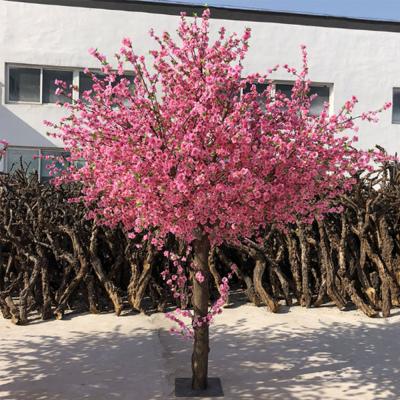 China Artistic high simulation silk plum artificial flower fake blossoms tree branches and leaves for home decor for sale