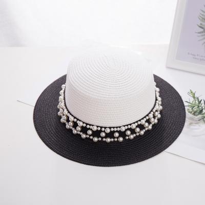 China New character flat surface Straw Hat Summer Women's travel edge leisure pearl wide Straw Hat Women Summer for sale