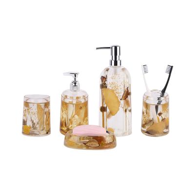 China Viable Transparent Acrylic Dry Flower Soap Dispenser Tumbler Soap Dish Toothbrush Holder Bathroom Accessories for sale