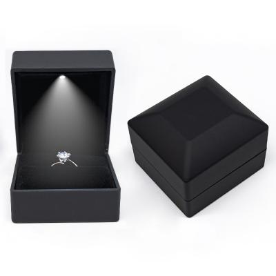 China Fashionable Luxury Custom Logo Plastic Wedding Diamond Ring Boxes Jewellery Packaging Led Jewelry Box With Led Light for sale