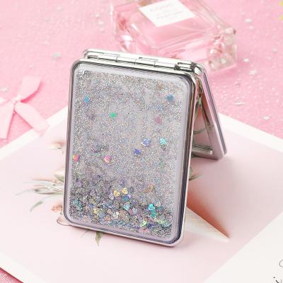 China Dual Sided Quicksand moving portable makeup mirror Double side compact mirror glitter foldable fashion hand mirror for sale