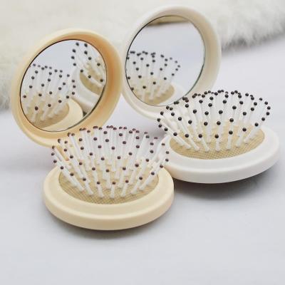 China Dual Sided Multi-Functional Hair Silicon Peine De Silicona Head Massager Mini Hair Plastic Hair Comb With Pocket Mirror Custom for sale