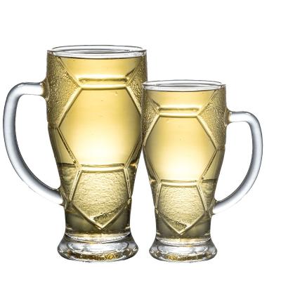 China Modern creative glass juice drinks personality bar beer draft handle beer football handle transparent glass mug for sale