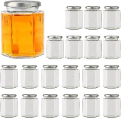 China Free samples 45ml 90ml 120ml 180ml 280ml 380ml 500ml food manufacturer clear hexagon glass jar for honey for sale