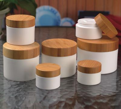 China Wholesale Personal Care Frosted Cosmetic Packaging Bottle Set 15g 30g 50g 100g Bamboo Lid Bamboo Cream Cosmetic Packaging Glass Jar for sale