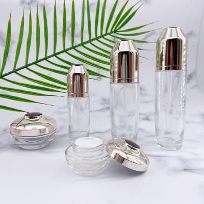 China High Quality Personal Care Glass Cosmetic Bottle And Jar Set With Pump Cap Glass Bottle Cosmetic Packaging Supplier for sale