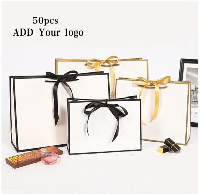 China Other Custom Purchases Paper Packaging Printing Paper Gift Boxes Wedding Bag Wrapping Paper With Handles For Garment Packaging Paper Bags for sale