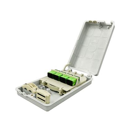 China Indoor CORE Fiber Optic Wall Mount FTTH Distribution Box FTTH Wall-mount FTTH Box with 12 Drop Ports IP43 for sale