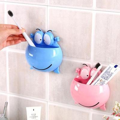 China Sustainable Cartoon Toothpaste Dispenser Toothbrush Holder Set Toothbrush Shelf With Suction Cup As Seen On TV Products for sale