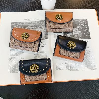 China Small Functional Luxury Brand Wallet Card Holder Travel Purse For Women PU Rivets Decoration Leather Card Case Elegant Purse For Ladies for sale