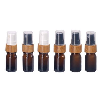 China 5ml personal care empty brown frosted amber glass bottle with 18/410 mist spray bamboo wooden fine lotion pump for sale