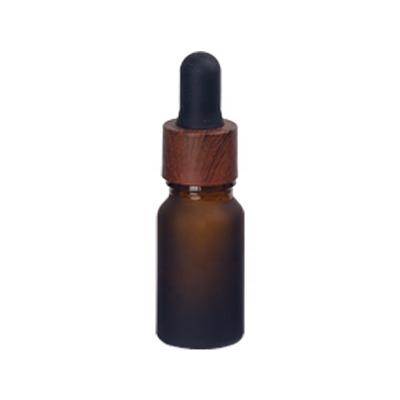 China Cosmetic 10ml Frosted Glass Bottle Brown Essential Cosmetic Package 10ml Frosted Amber Cosmetic Bottle With 18/410 Wooden Dropper for sale