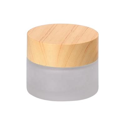 China Cosmetic Jar 15g 15ml Face Cream Cosmetic Glass Jar Frosted Glass Jar With Wooden Lid for sale