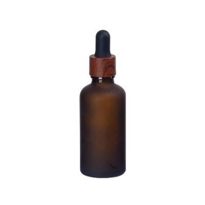 China Personal Care 50ml Frosted Brown Glass Dropper Bottle 50ml Frosted Amber Glass Cosmetic Bottle With Water Transfer Plastic Wooden Dropper for sale