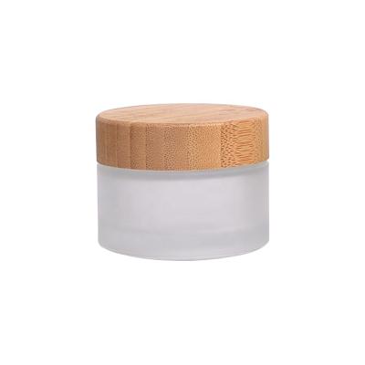 China Empty Cosmetic Bamboo Glass Jar 50ml Face Cream Container Frosted Glass Jar With Bamboo Lid Personal Care Bamboo Packaging for sale