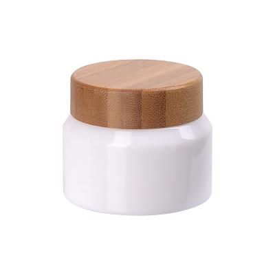 China 50ml Opal White Glass Cosmetic Jars 50g Skin Care Face Cream Cosmetic Jars With Bamboo Wooden Lid Shoulder Sloping Glass Jar for sale