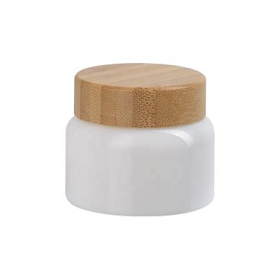 China Opal White Curve-shape 50ml Opal White Curve-shape Opaque Glass Cosmetic Jar 50g Skin Care Face Cream Jars With Bamboo Wooden Lid for sale