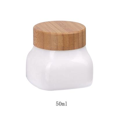 China Cosmetic 50ml 50g Square Glass Jar Jars Empty Opal Glass Cosmetic Glass Jar Skin Care Face Cream Jar With Bamboo Lid for sale