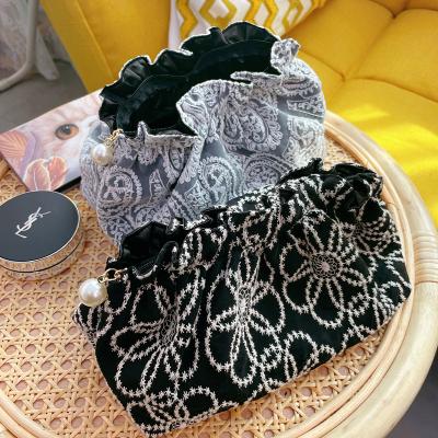 China Fashion Black Retro Lace Embroidered Flowers Closed Makeup Storage Bag Handbag for sale