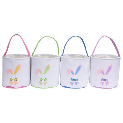 China 100% Eco-Friendly 4 Colors Easter Bunny Basket Lovely Cartoon Rabbit Ear Printed Candy Egg Storage Bucket Happy Easter Supplies for sale