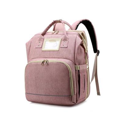 China Custom Water Resistant Pink Mom Deluxe Backpack Baby Diaper Bags Bed Backpack for Mother with Changing Station Organizer for sale