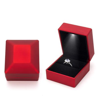 China High Quality Led Ring Pendant Box Luxury Wedding Gift Black Suede Plastic Led Jewelry Box Light for sale