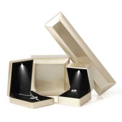 China High Quality Luxury Black Plastic LED Velvet Jewelry Boxes Wedding Jewelry Ring Box Romantic Gift Boxes or Cases for sale