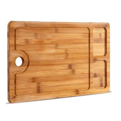 China Customized Sustainable Built-in 2 Compartment Cutting Plate Kitchen Bamboo Cutting Board with Juice Groove for sale