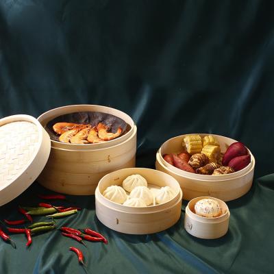 China Sustainable Wholesale Eco-Friendly Natural Kitchenware Dumpling Round Bamboo Steamer Dim Sum Steamer Basket With Handle for sale