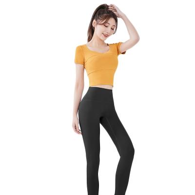 China Top Yoga Breathable Splice Quick Dry Clothes With Naked Thin Tights Sports Bare Slim Tights Yoga Shorts Sleeve Feeling Top Fitness for sale