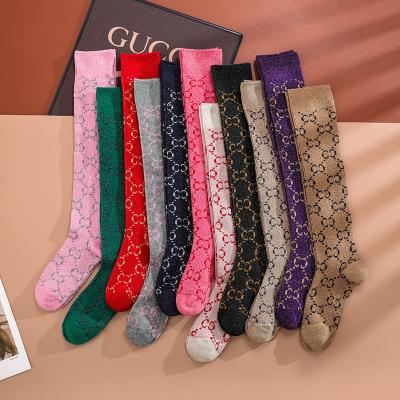 China QUICK DRY double letter G bright silk gold and silver double needle stocking calf socks fashion silk knee socks for sale