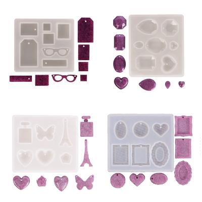 China Europe Yiwu Factory Supply 4 Pieces Heart Perfume Bottle Tower Glass Butterfly Geometry Base Shape Transparent Epoxy Resin Molds for sale