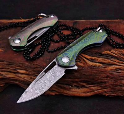 China Sustainable Mini Folding Pocket Knife 110 Layers of Damascus Steel 9Cr18MoV Blade with Titanium Handle Vacuun Heat Treatment for sale