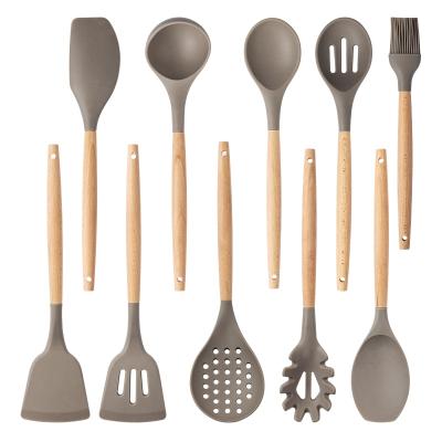 China Viable the price is good 10 pieces of wooden silicone kitchenware handle cookware set for sale