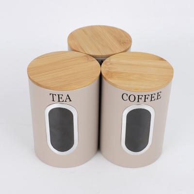 China Sustainable Kitchen Round Metal Canisters With Bamboo Lid And Windows For Sugar Coffee Tea for sale