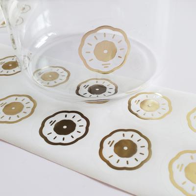 China Waterproof Customized Printing Hot Stamping Transparent Sticker Gold Foil Clear Vinyl Logo Label Sticker Paper for sale